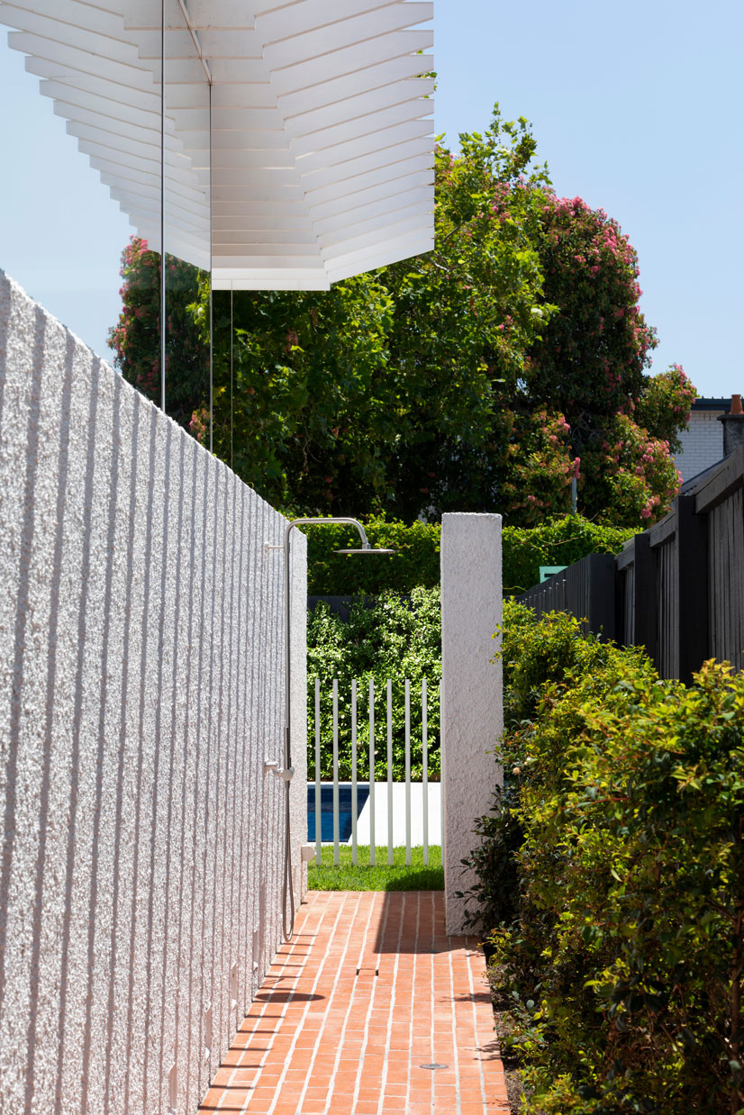 Melbourne Architecture. Shadowplay on textured stucco wall, leading to outdoor shower and swimming pool. 