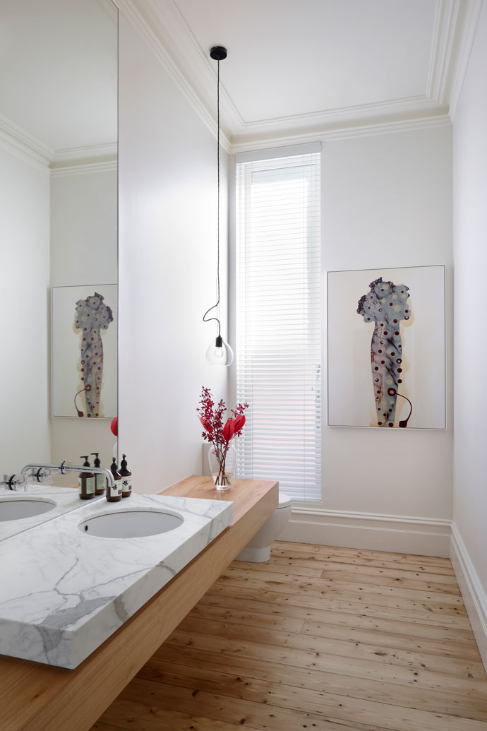 View to the powder room at the heritage section of Hawthorn House. Marble and natural timber vanity references the finishes in the new addition at the rear of the house.