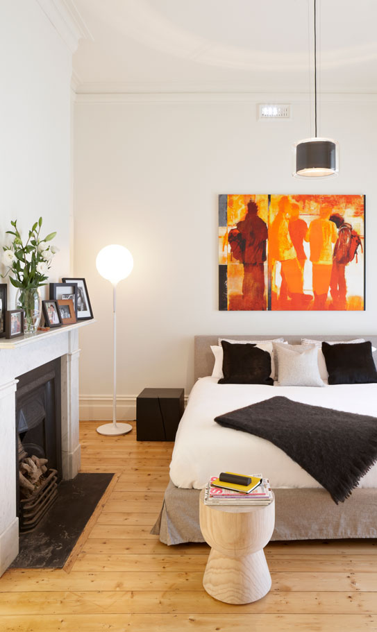 Detail from a heritage bedroom at Hawthorn House with heritage fireplace and contemporary furnishings.