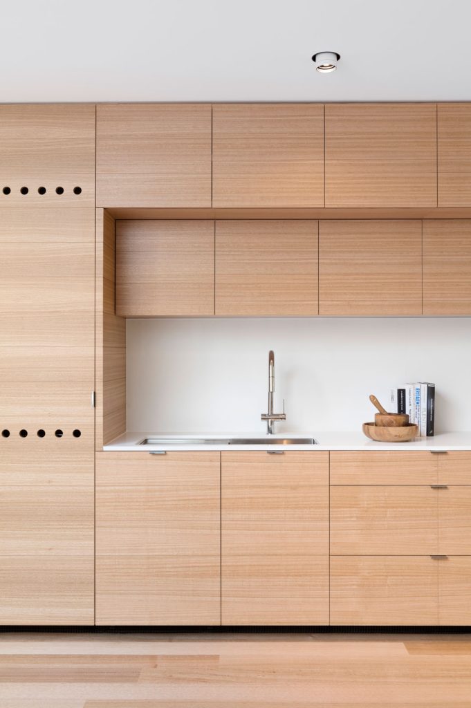 Prahran House Kitchen Joinery. Horizontal timber finish on kitchen joinery brings texture and warmth to the interior.