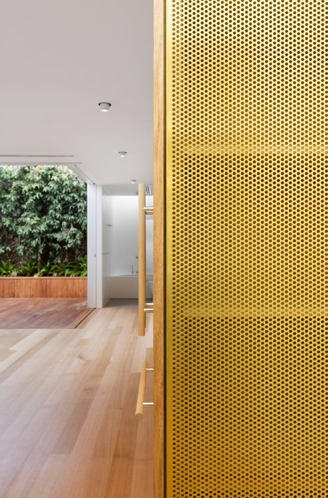 Prahran House Joinery Detail. External materials of horizontal timber and perforated metal are repeated internally, conjoining the interior and exterior to form a larger whole.