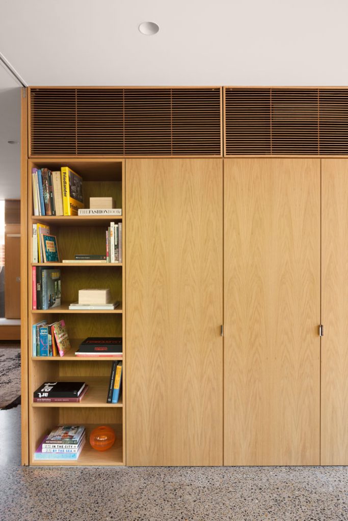 Timber Built-in joinery and shelves at the study with timber grills above. 