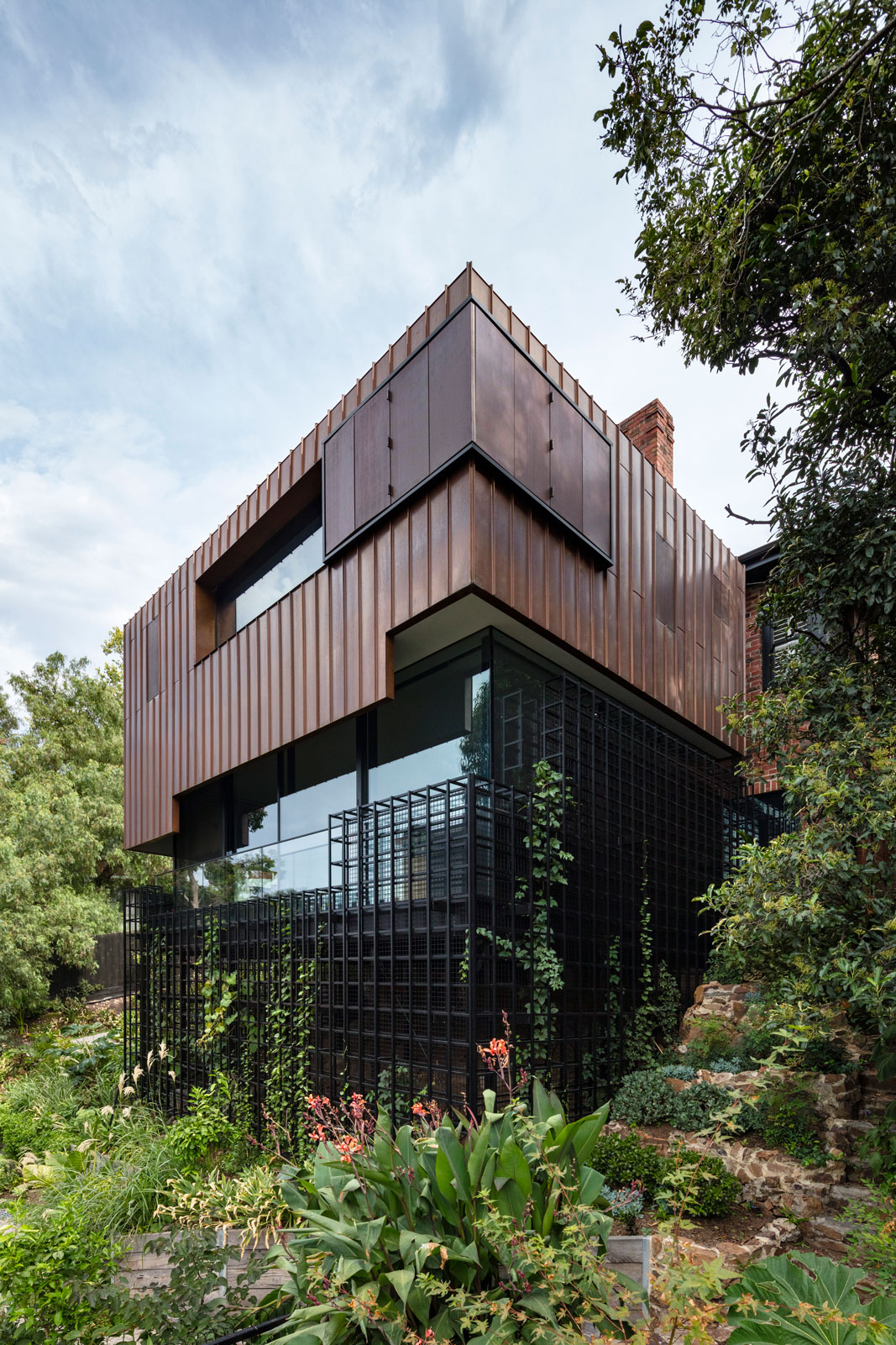 Copper clad house over a black spaceframe.