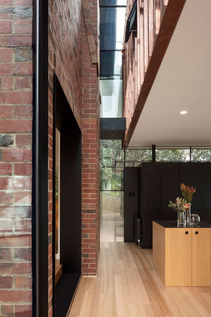 Residential architecture. Double height glazed void separating the new addition from the existing heritage dwelling