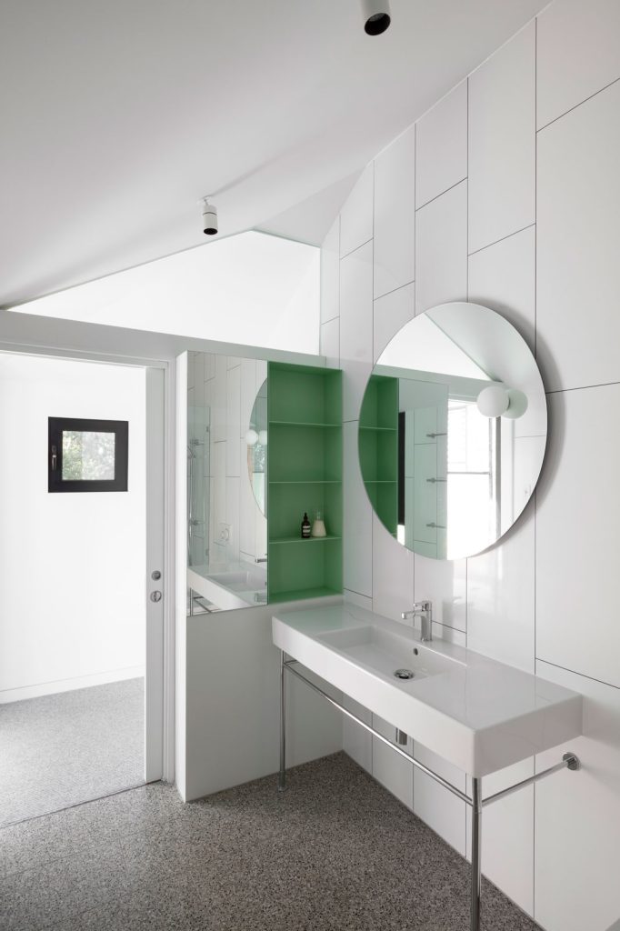 Local architects. White minimal bathroom interior with green shelves